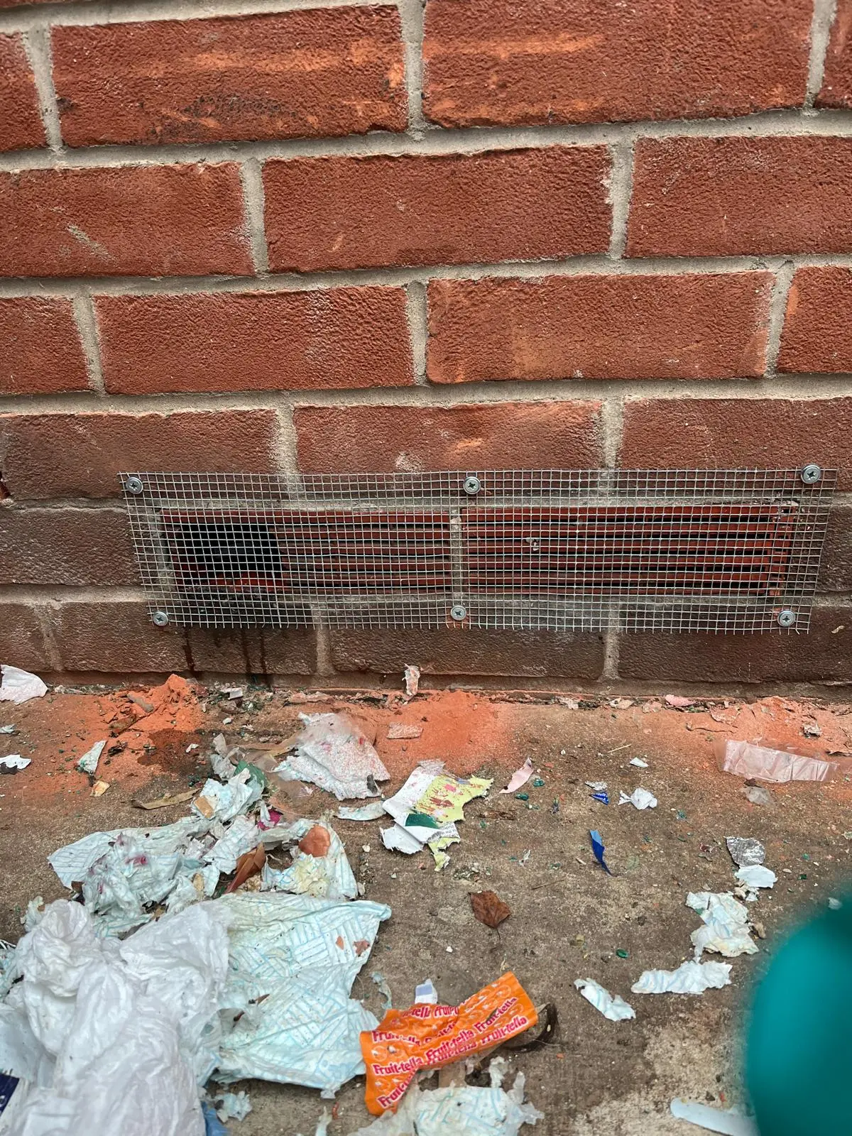 Steel mesh proofing fitted over an air vent chewed open by rodents