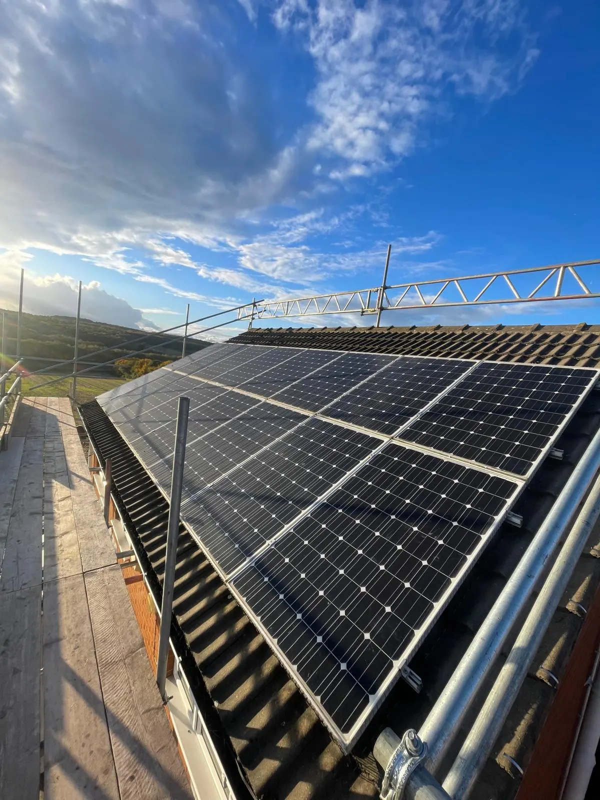 Solar panel bird proofing on-site preparation with scaffolding erected for safe roof access