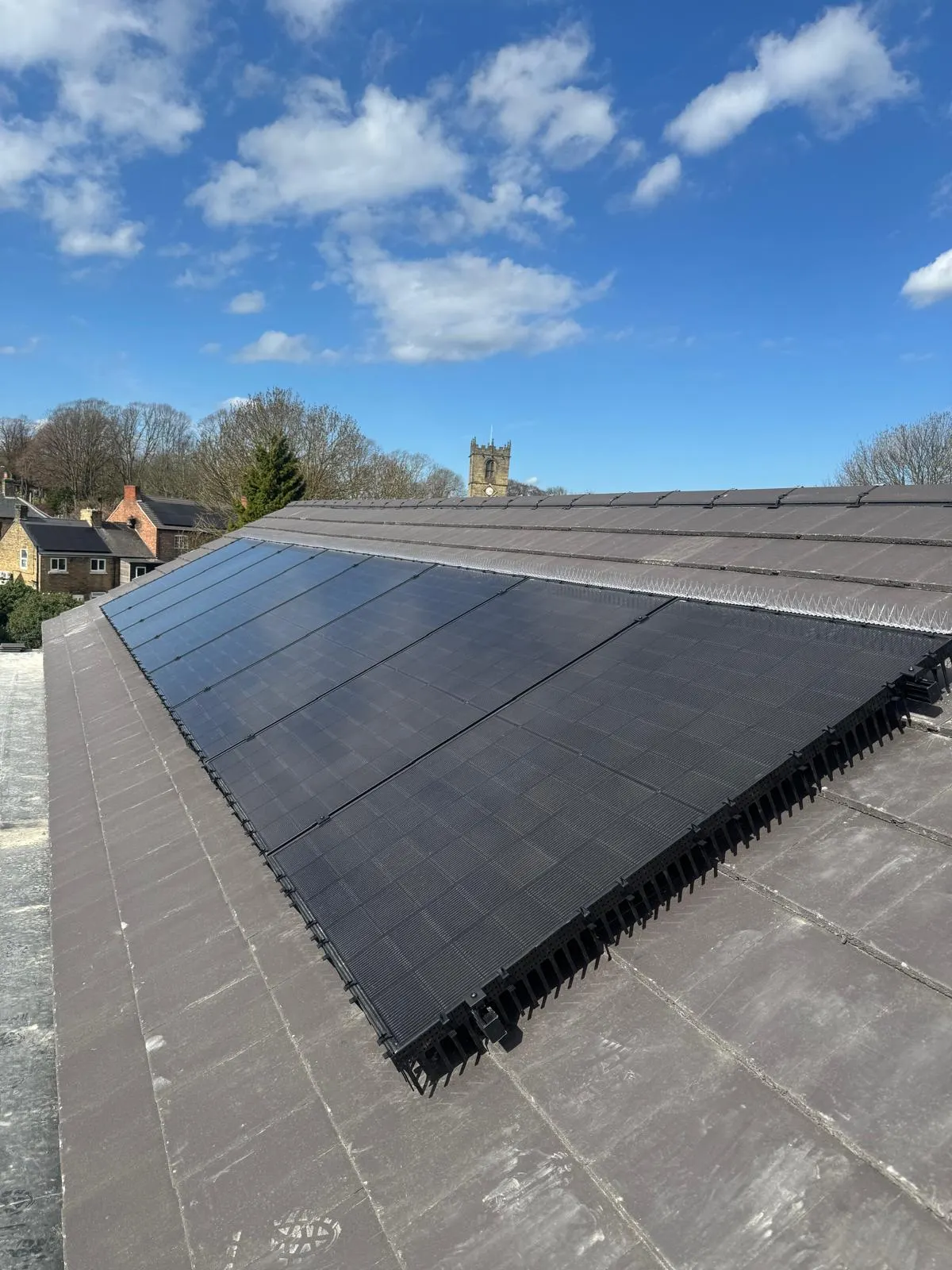 Solar panel side guards and spikes installed by Apex